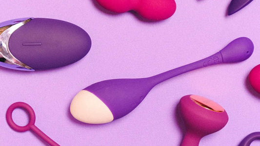 Purple and pink vibrators on soft lavender background, premium adult toys collection