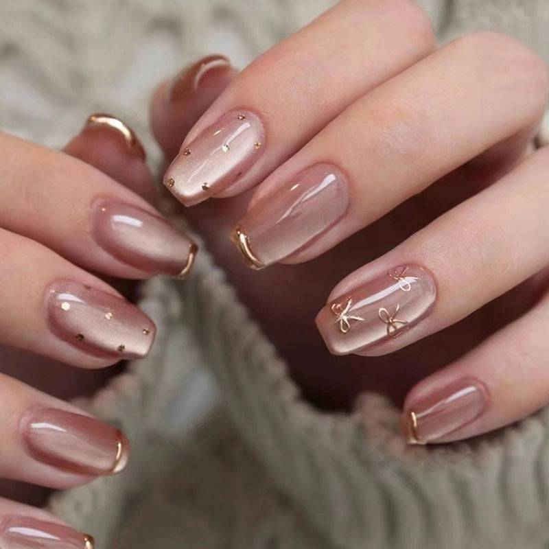 Nude Press-On Nails with Gold Marble Design Wearing - 24 Piece Set for a Sophisticated Look